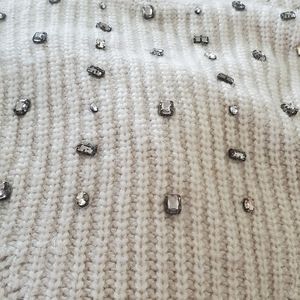 Cream color embellished funnel neck sweater